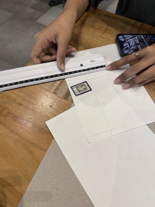 person mecuring with a ruler